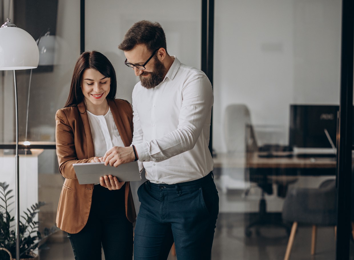 Two Business Partners Working In Office