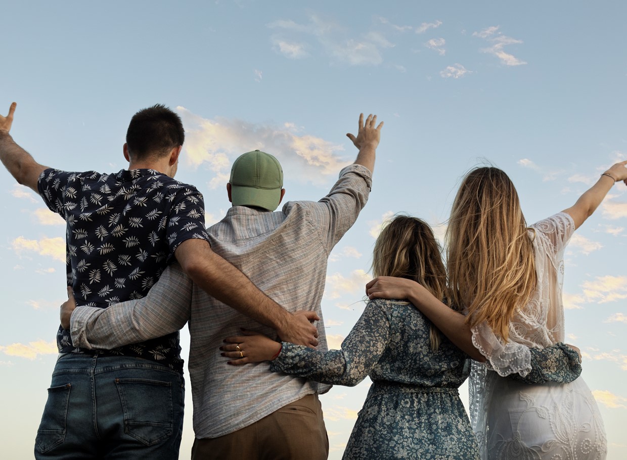 Friends Embracing Beach Looking Sky