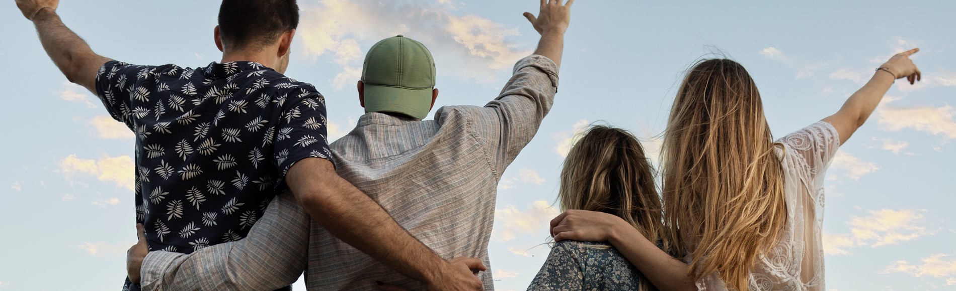 Friends Embracing Beach Looking Sky